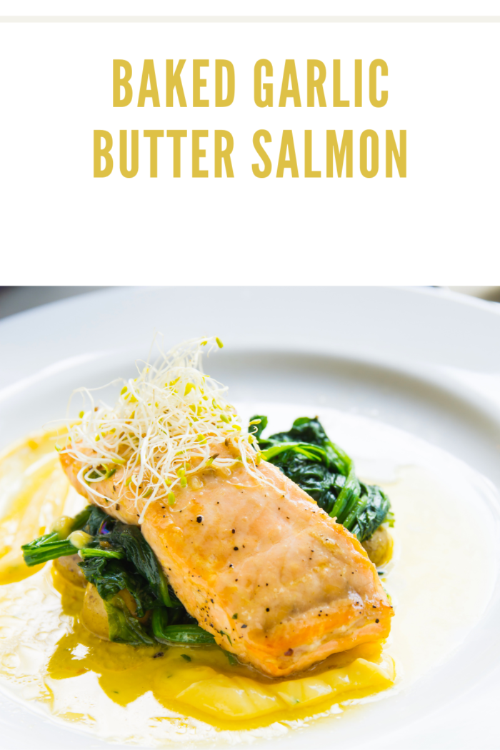 salmon on greens and garlic butter sauce