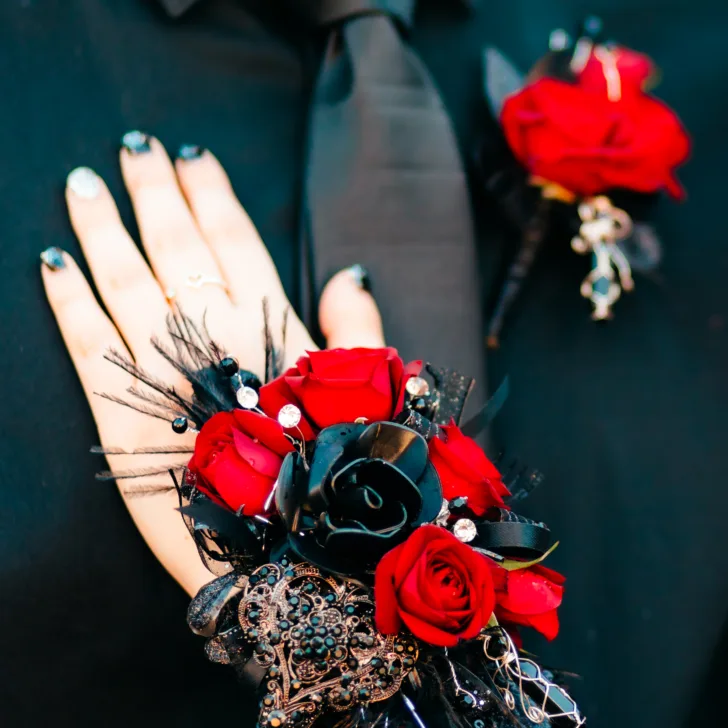 black corsage and boutonniere