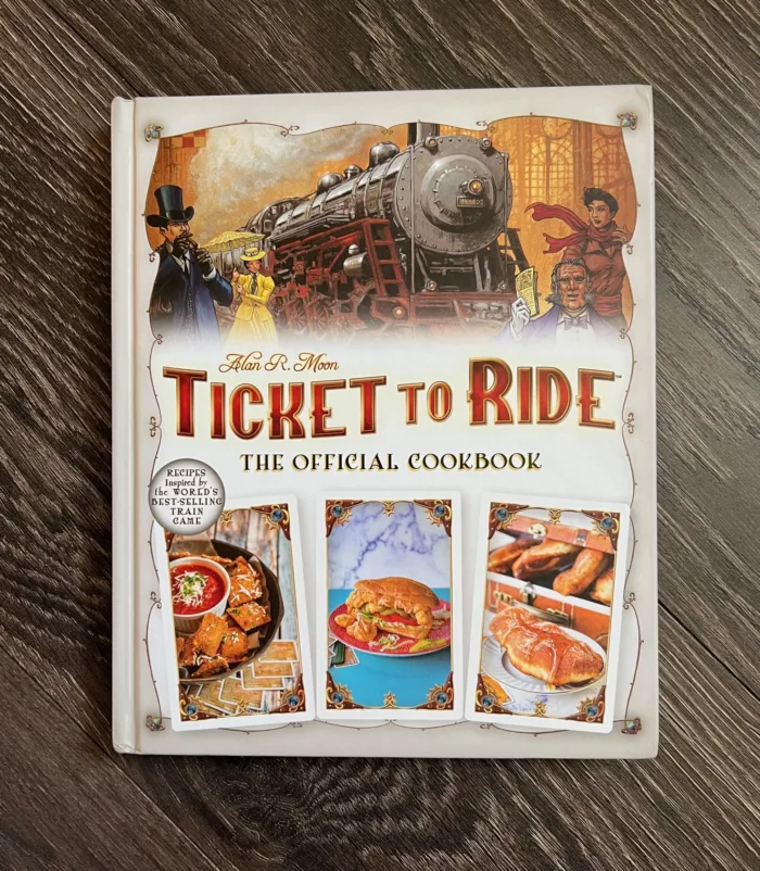 ticket to ride official cookbook on wood background