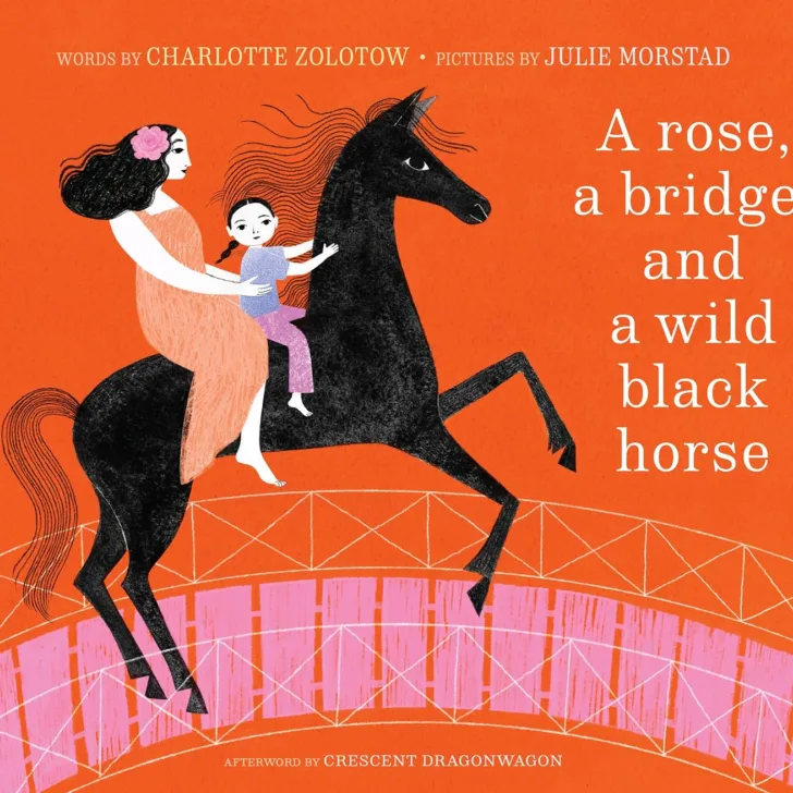 a rose a bridge and a wild black horse