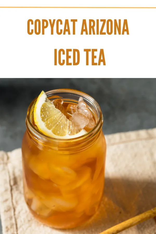 Overhead view of copycat Arizona iced tea with lemon wedge in a mason jar