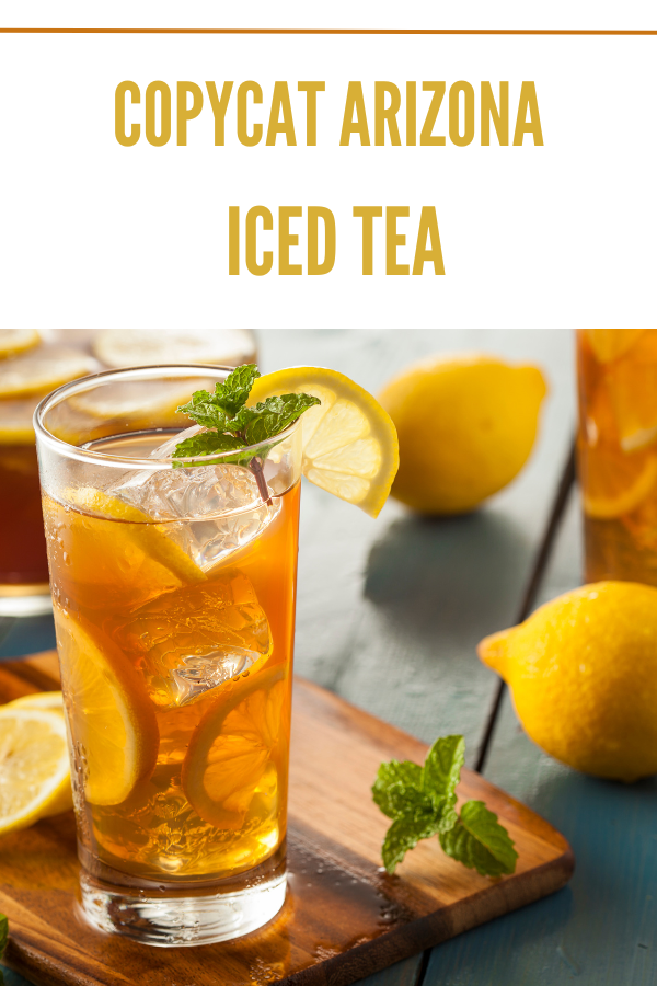 Copycat Arizona iced tea with ice, garnished with lemon wedge and mint, with fresh lemons in background