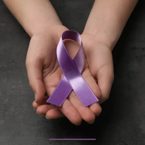 Closeup of woman holding purple awareness ribbon, symbolizing early epilepsy signs and awareness