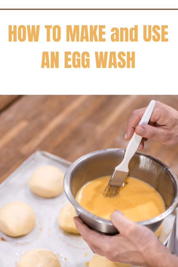 Egg wash being brushed over rolls ready for baking, ensuring a golden, glossy finish.