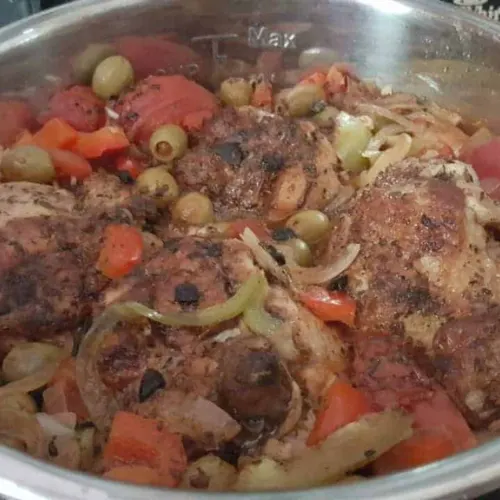 Finished Instant Pot chicken and rice (Arroz con Pollo) meal ready to serve in the pot.