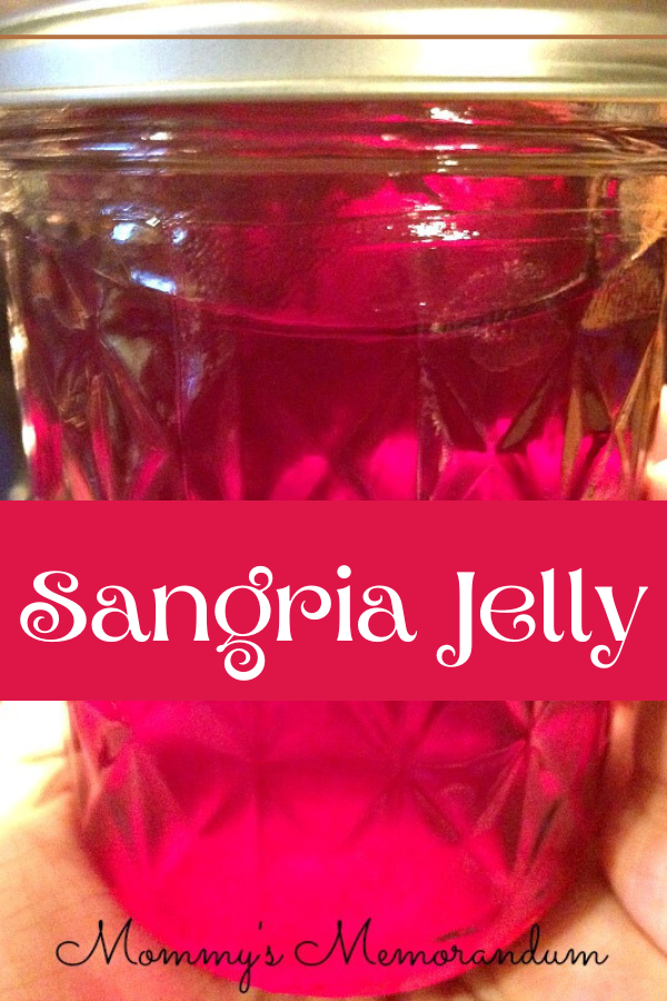 Homemade sangria jelly in a jar, ideal for cheese boards and creative snacks.