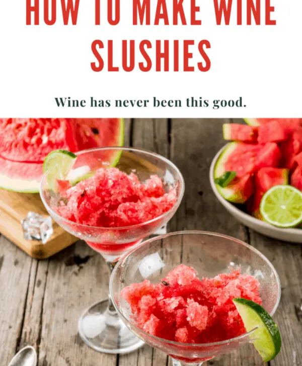 A glass of homemade wine slushie garnished with fresh fruit, ideal for a summer party or casual gathering.