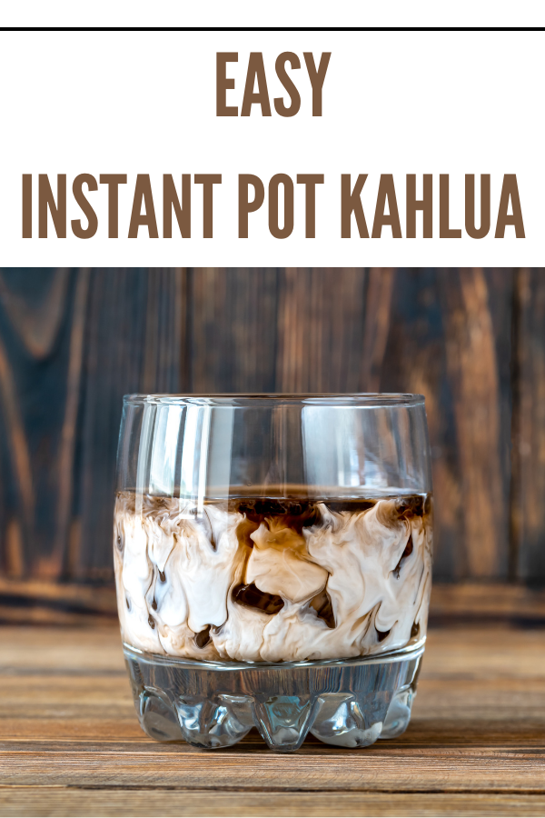 Glass of Instant Pot Kahlua mixed with cream and ice, perfect for coffee-flavored cocktails or desserts.