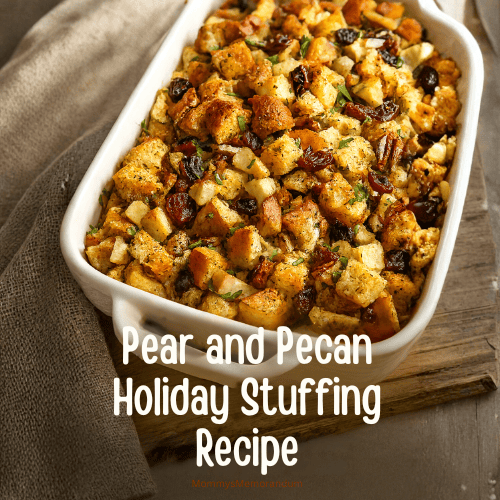 Golden-brown pear and pecan stuffing in a white casserole dish, featuring buttery bread cubes, tender pears, cranberries, and toasted pecans. Styled on a rustic holiday table with warm lighting and cozy autumn props.