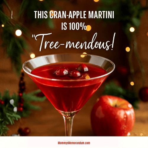 A vibrant Cranberry Apple Martini garnished with fresh cranberries, set against a cozy holiday backdrop with twinkling lights and a red apple. Overlay text reads: “This Cran-Apple Martini is 100% Tree-mendous!”