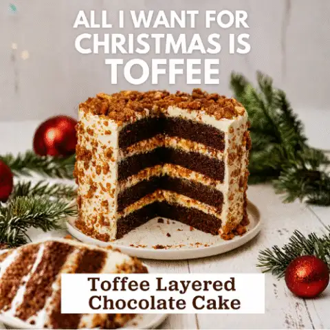 Four-layer chocolate cake with mascarpone frosting and homemade toffee, styled for Christmas with a slice removed and crumbs on the plate.
