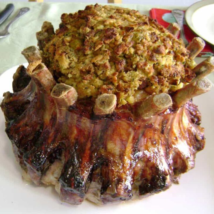 Stuffed crown roast with apricot preserves and a savory sausage stuffing, perfect for festive meals