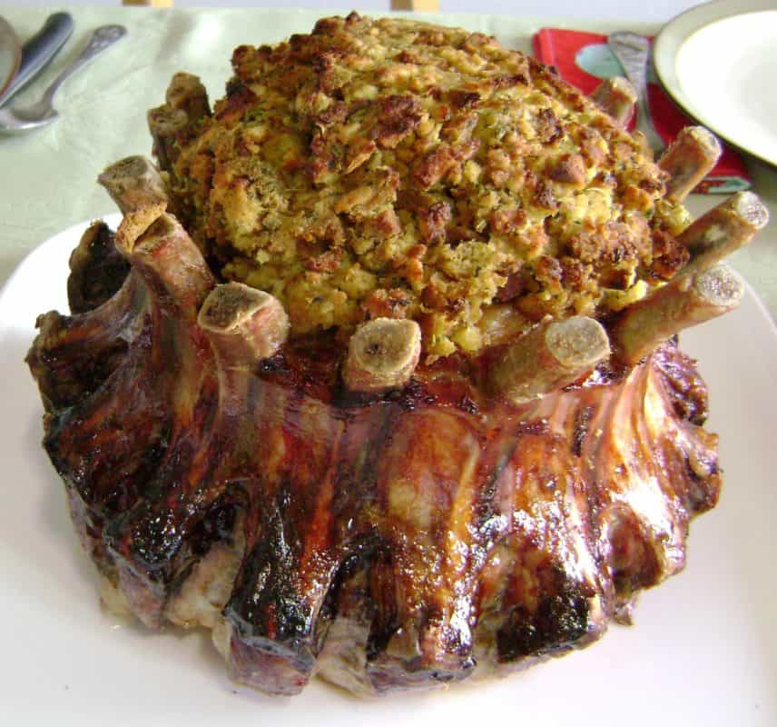 Stuffed crown roast with apricot preserves and a savory sausage stuffing, perfect for festive meals