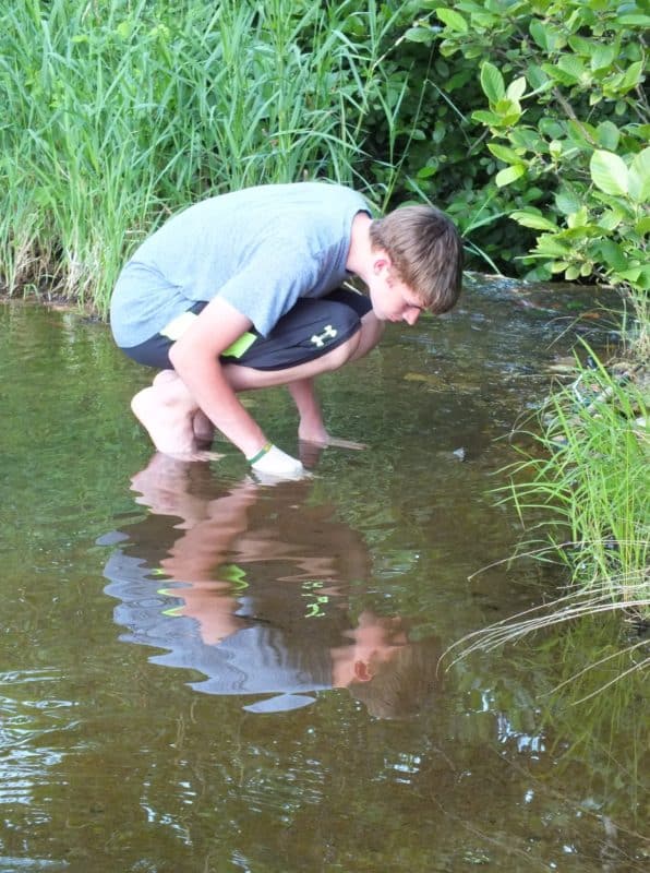 If I didn't know he was trying to catch more baby catfish, I'd say, "Mirror, Mirror on the lake, whose the Fisher King?"