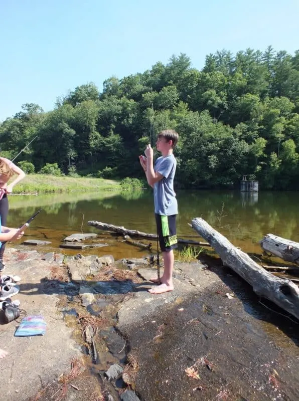 Cooper begins to get his fishing rod ready