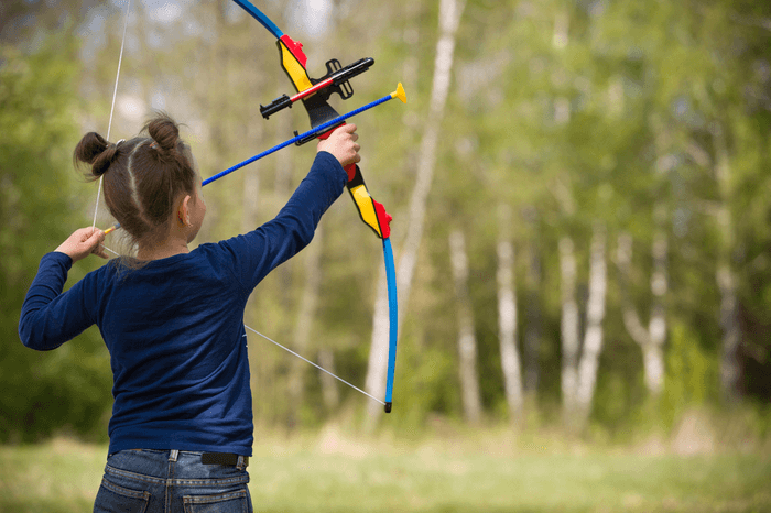 girl practicing archery