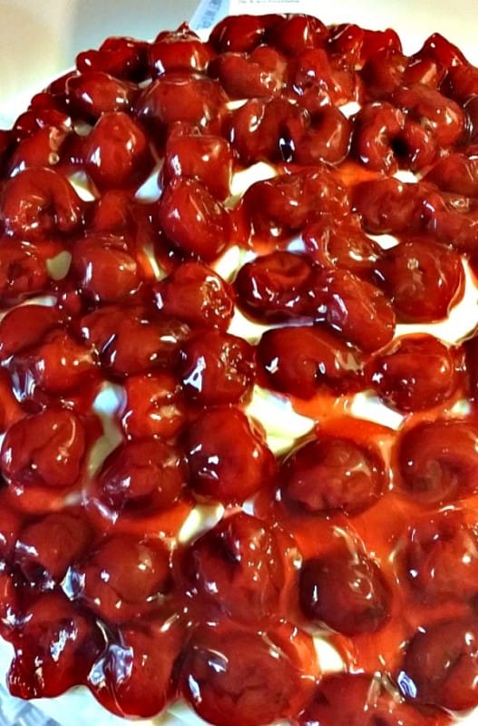 Add-cherries to the cream cheese frosting