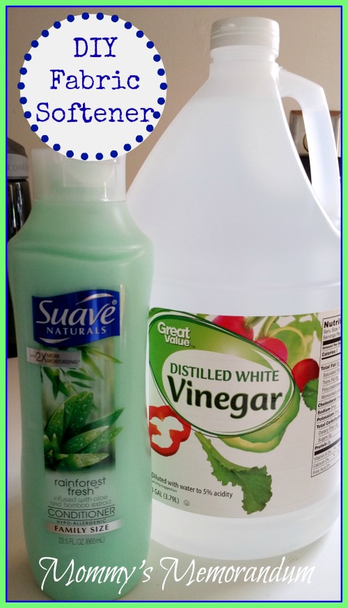 A bottle of Suave conditioner and a gallon of distilled white vinegar used to make DIY fabric softener.
