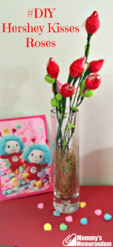 A bouquet of DIY Hershey Kisses roses in a glass vase, perfect for Valentine's Day or special occasions.