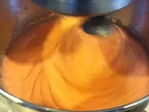 Bowl of TGIF Strawberry Shortcake Cupcakes batter being mixed with fresh ingredients for a tasty cupcake treat.