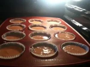 TGIF Strawberry Shortcake Cupcakes baking in the oven, rising to fluffy perfection for a sweet strawberry treat.