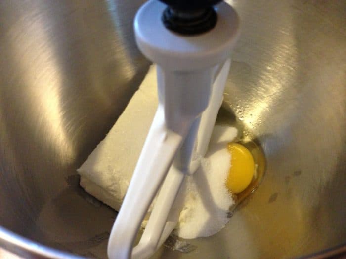 Mix cream cheese, egg and sugar until well blended.