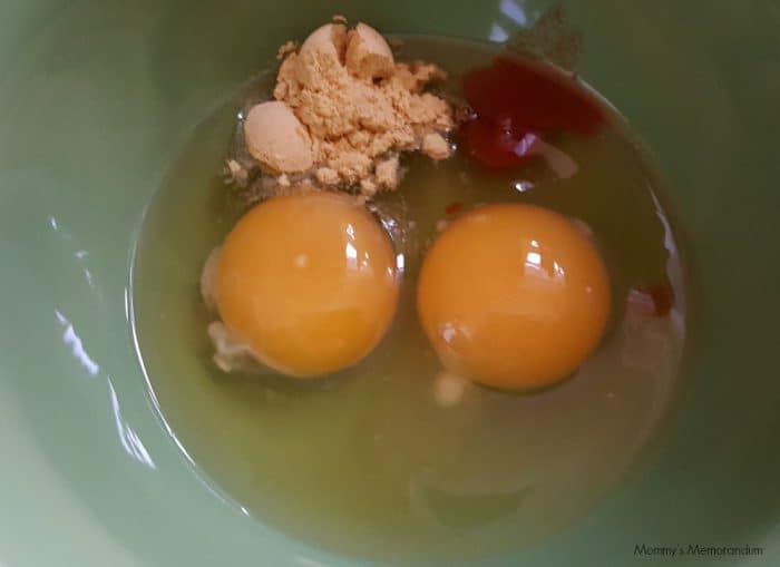 2 eggs and seasoning in bowl