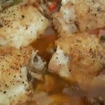 Close-up of Instant Pot Chicken Cacciatore featuring juicy chicken pieces in a rich tomato sauce, garnished with pepper