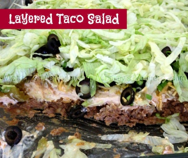 Loaded Taco Layer Dip Recipe for Parties and Potlucks Easy Taco Layer Dip layered with seasoned ground beef, cheddar cheese, lettuce, tomatoes, black olives, and avocado served with tostado chips