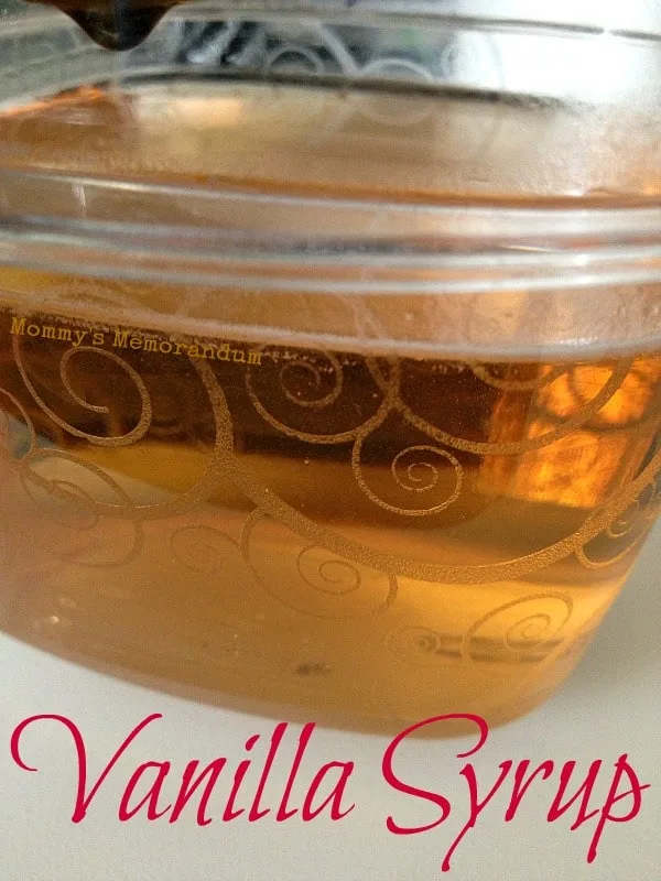 Close-up of homemade vanilla simple syrup in a decorative jar