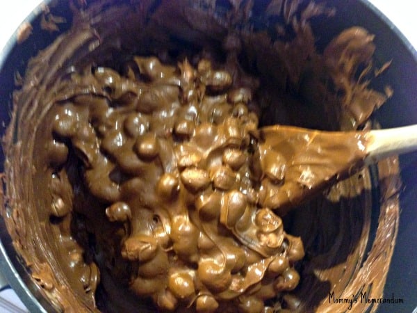 chocolate cinnamon peanut clusters being stirred