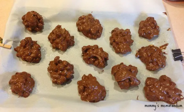 chocolate cinnamon peanut clusters on parchment