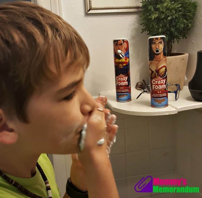 A young boy enjoying bathtime with Superman and Wonder Woman Crazy Foam, capturing the nostalgic fun of this classic product.