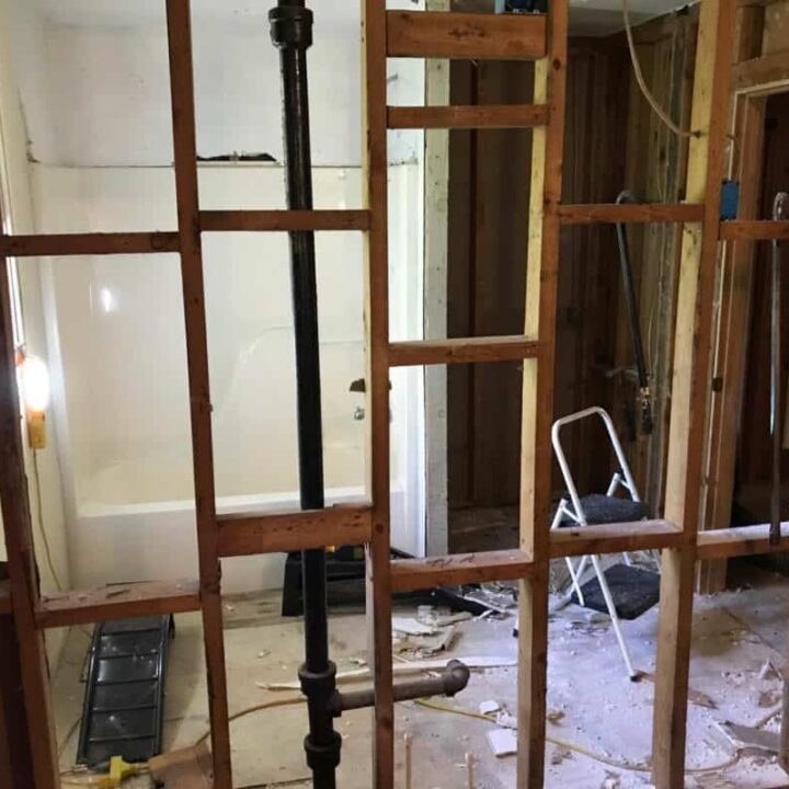 dad's house bathroom demolition looking through kitchen wall