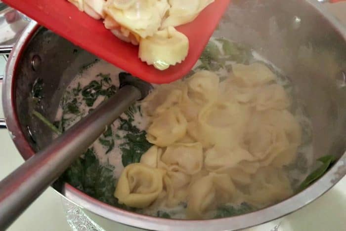 easiest cheesiest tortellini bake recipe add tortellini to pan