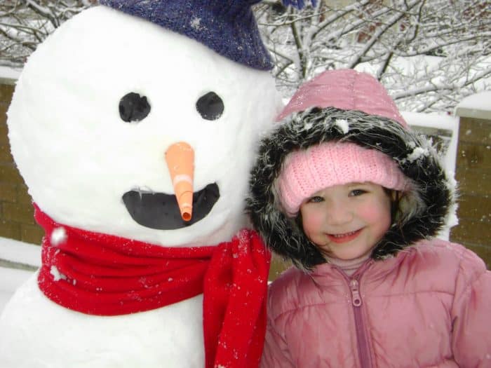 mackenzie with snowman