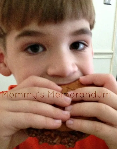 Kids eating a sloppy joe made with Manwich sauce, enjoying the tangy, savory flavors during family dinner.