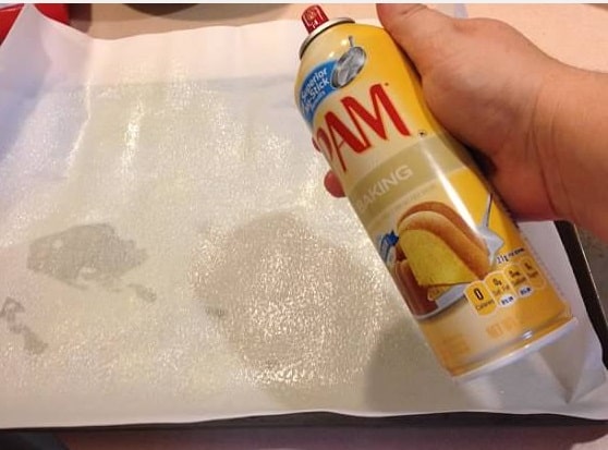 spray parchment paper with pam