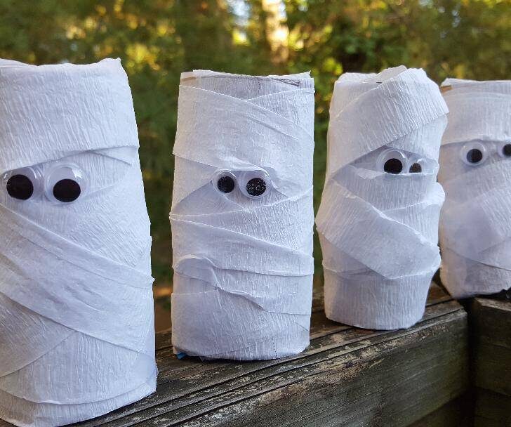 DIY paper roll mummy craft for Halloween with Welch's Fruit Snacks, ideal for party favors and decorations