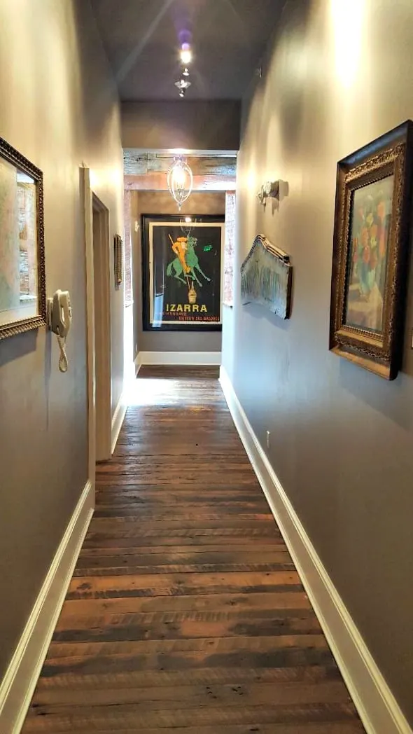 windsor boutique hotel hallway with izarra poster