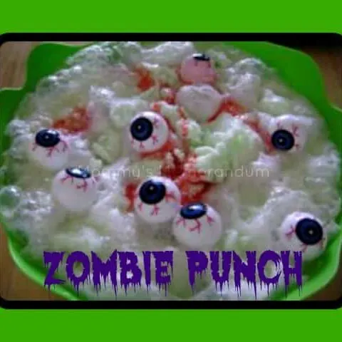 Spooky Zombie Punch with lime sherbet and plastic spiders, perfect for Halloween parties